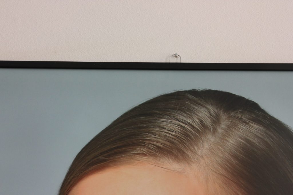 Poster mit Bindeleisten und Metallaufhänger